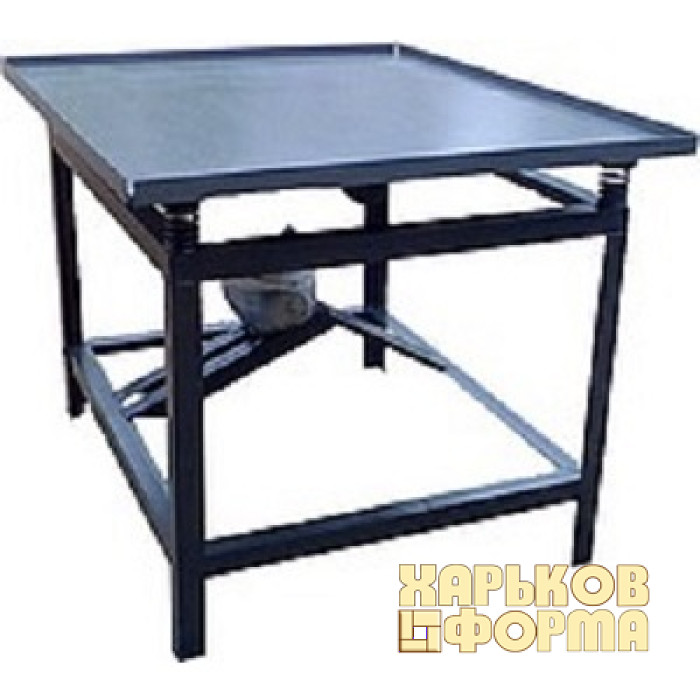 Vibrating table for the production of paving slabs 